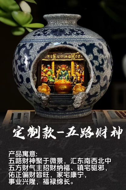 Promotional product shot of a blue and white porcelain vase with Five Roads God of Wealth shrine diorama inside, with Chinese text overlay reading 定制款五路财神 on a dark background